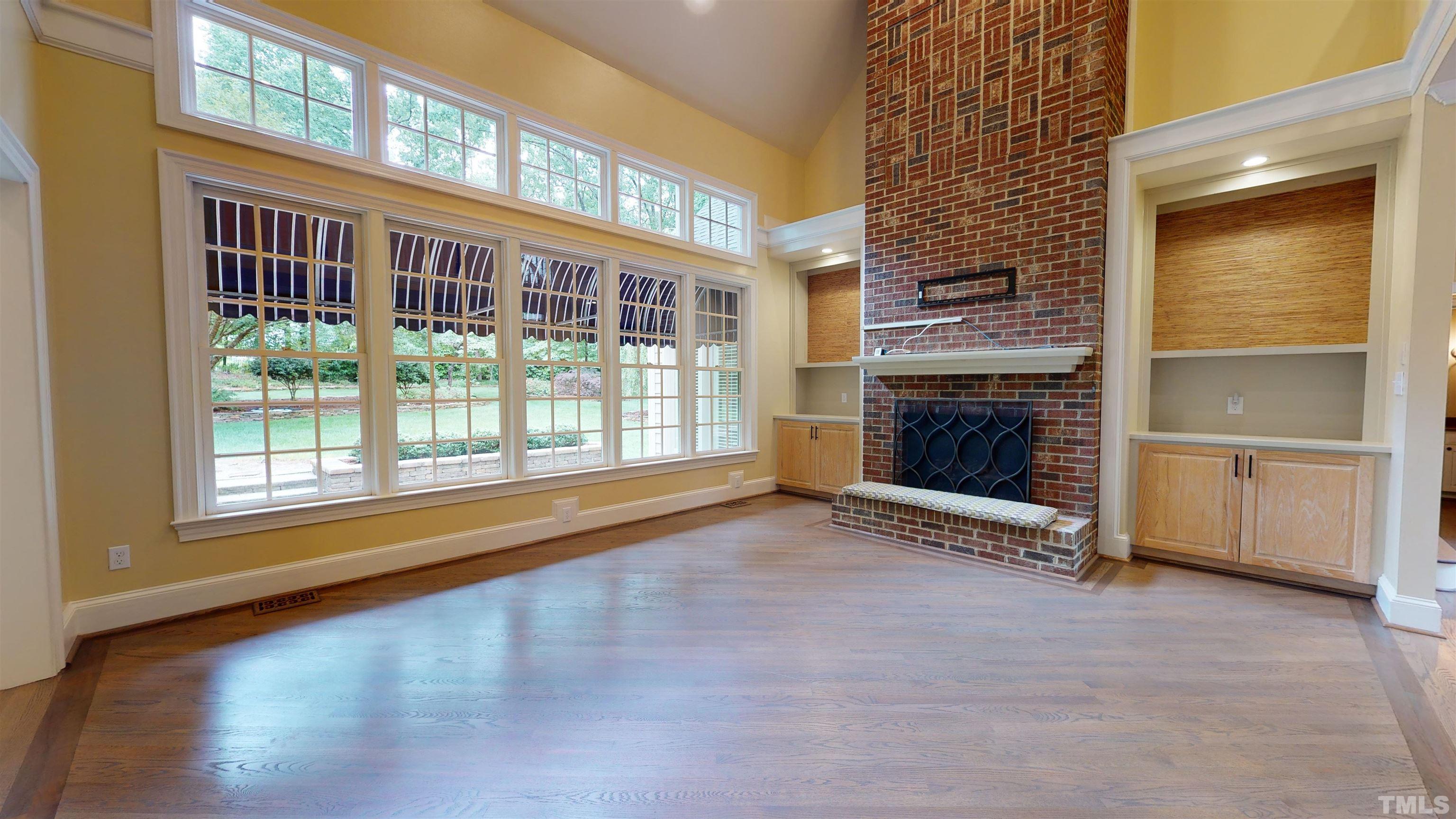 1624 Adams Mountain Road Raleigh, NC 27614 - Photo 41 of 100 a view of an empty room with a fireplace and a window