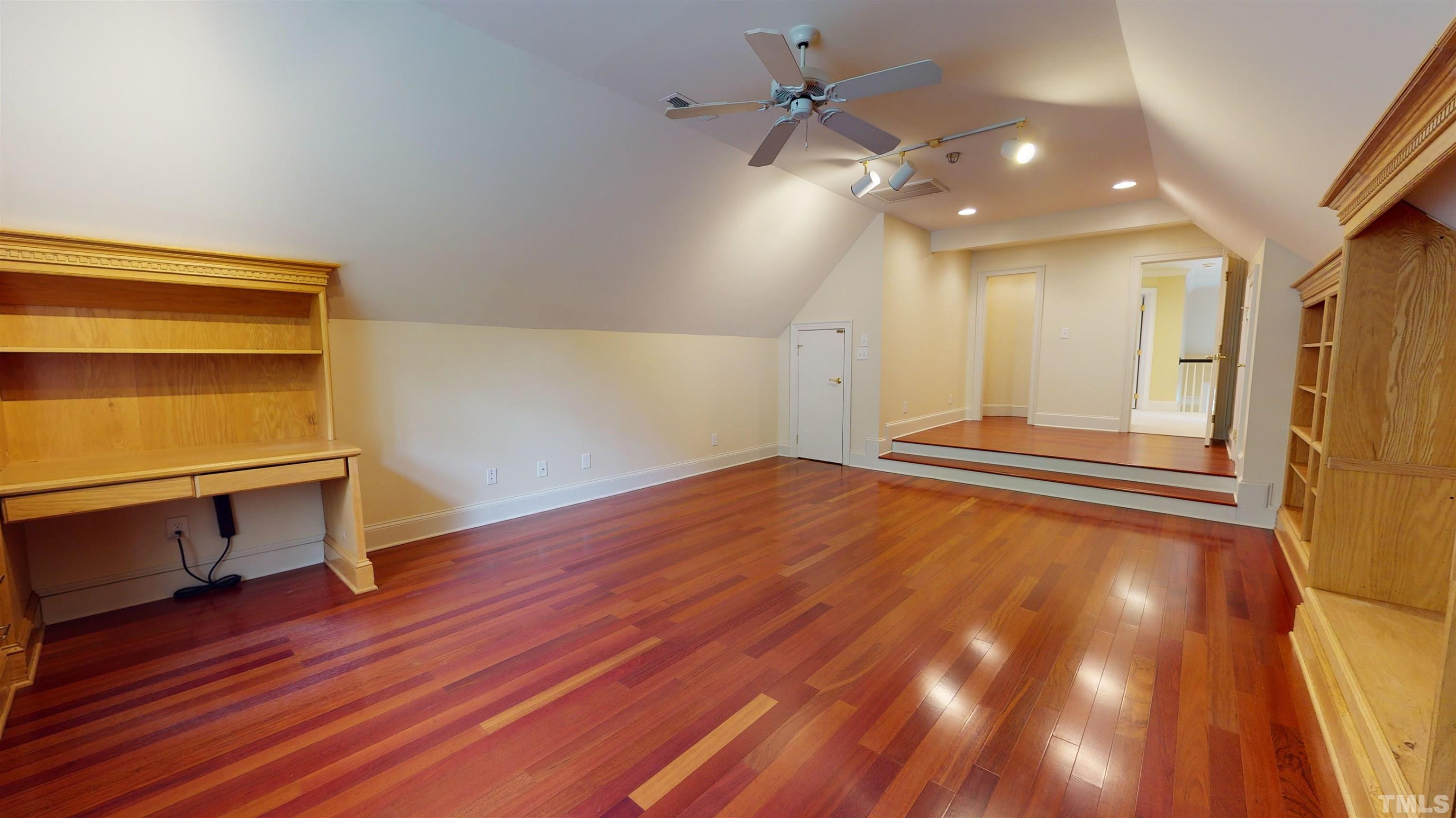 1624 Adams Mountain Road Raleigh, NC 27614 - Photo 59 of 100 a view of an empty room with wooden floor and a window