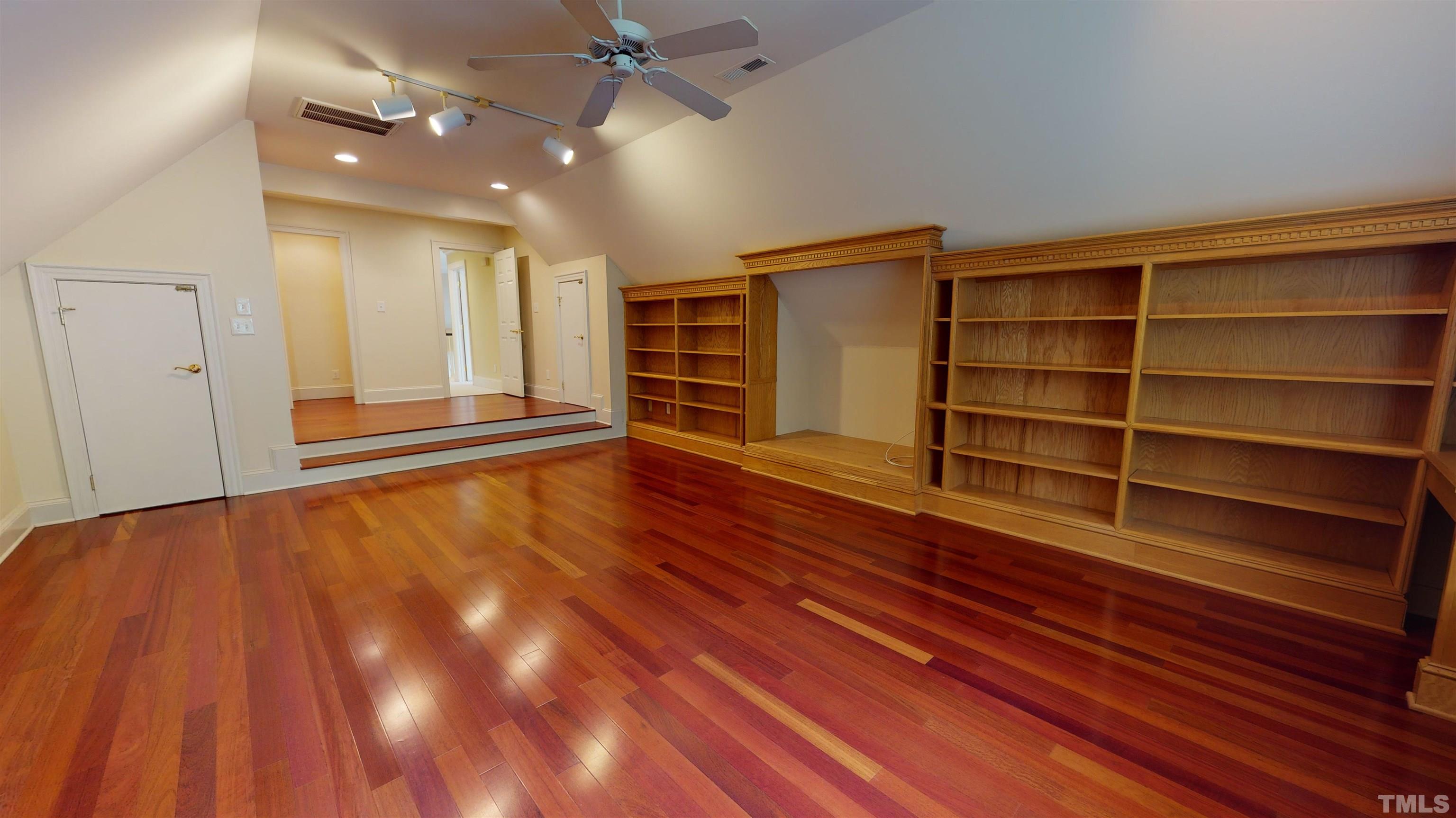 1624 Adams Mountain Road Raleigh, NC 27614 - Photo 60 of 100 a view of an empty room with a window and wooden floor