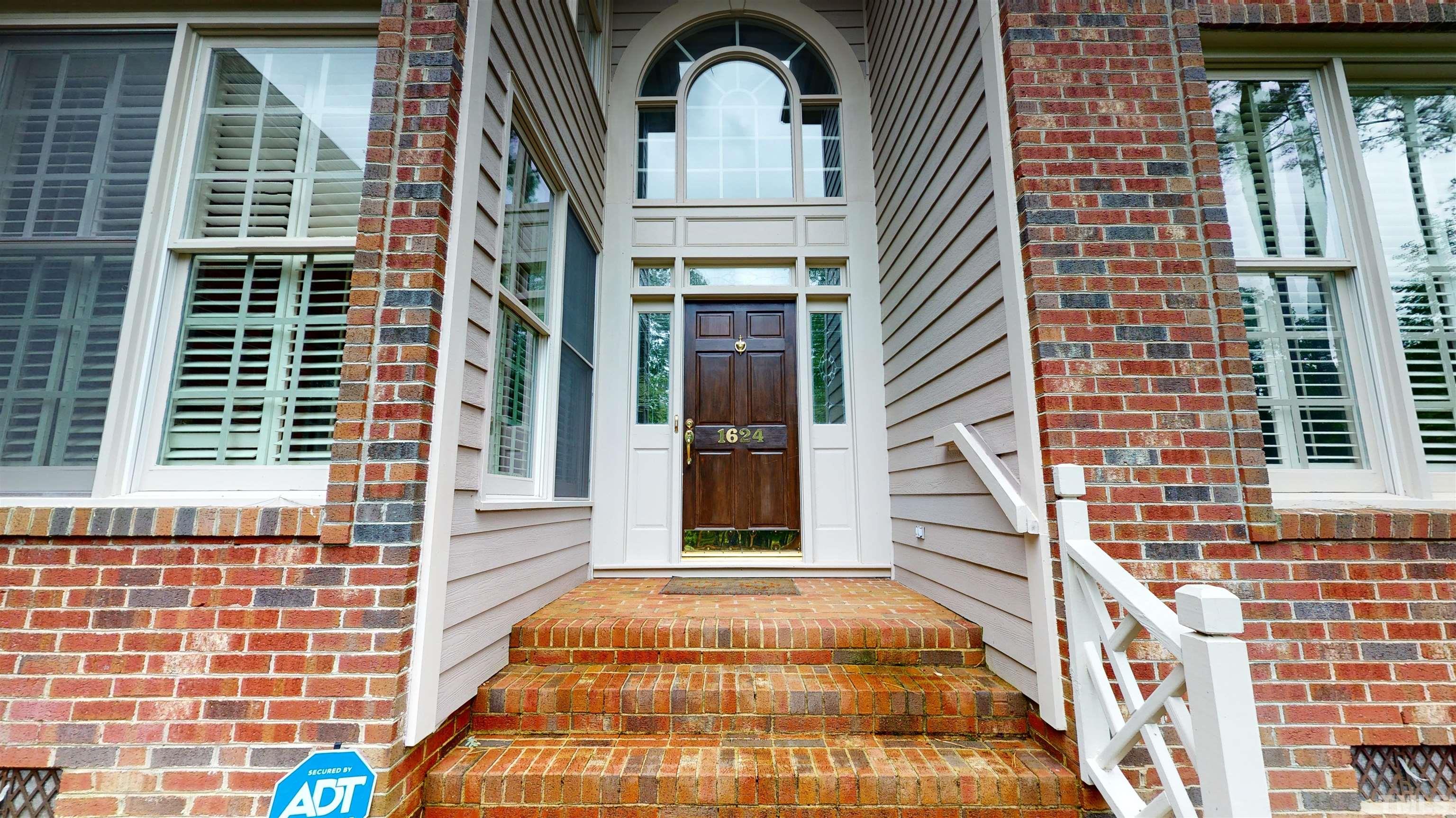 1624 Adams Mountain Road Raleigh, NC 27614 - Photo 77 of 100 a view of a brick house with many windows
