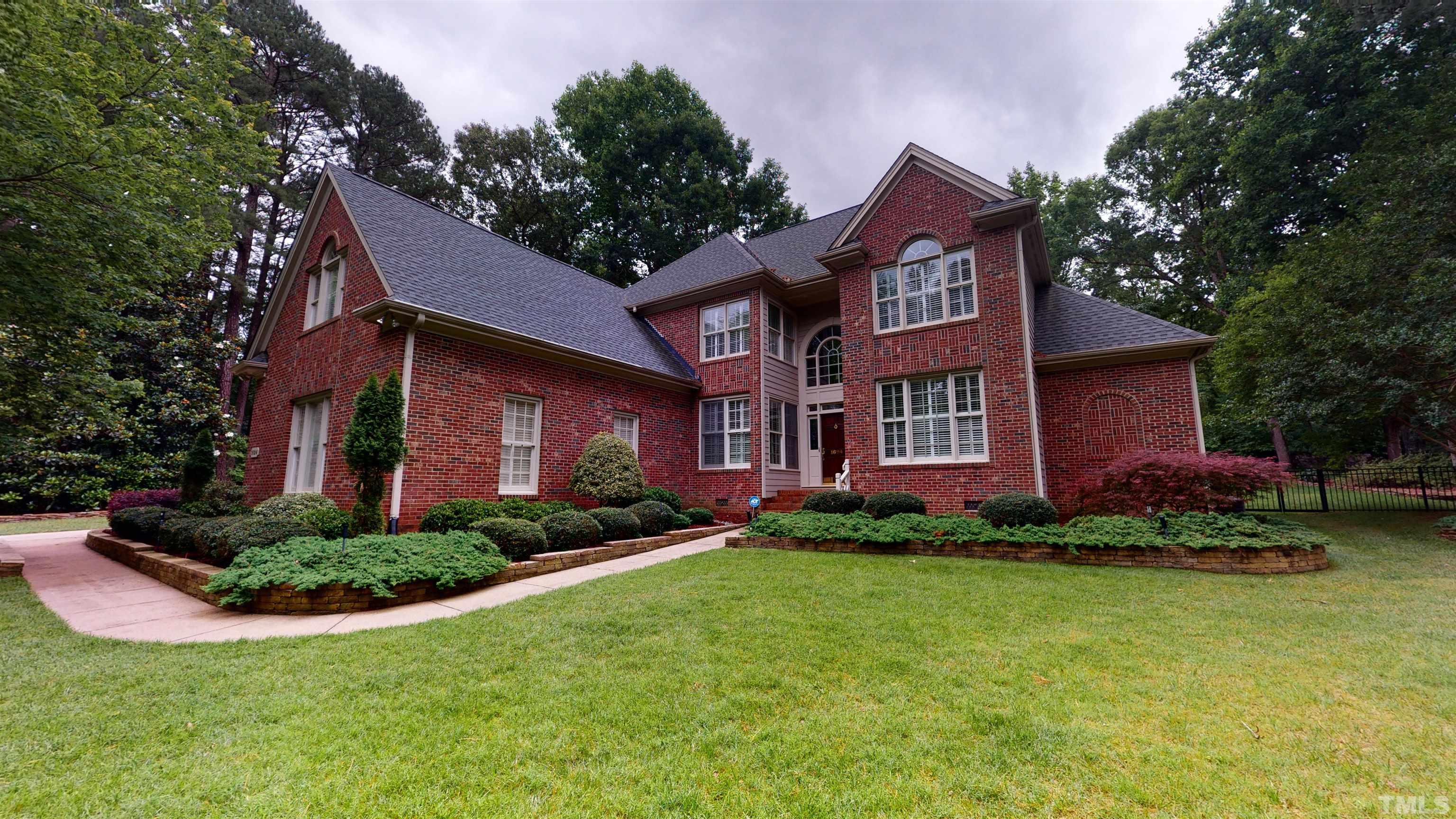 1624 Adams Mountain Road Raleigh, NC 27614 - Photo 78 of 100 a front view of a house with a yard and garage