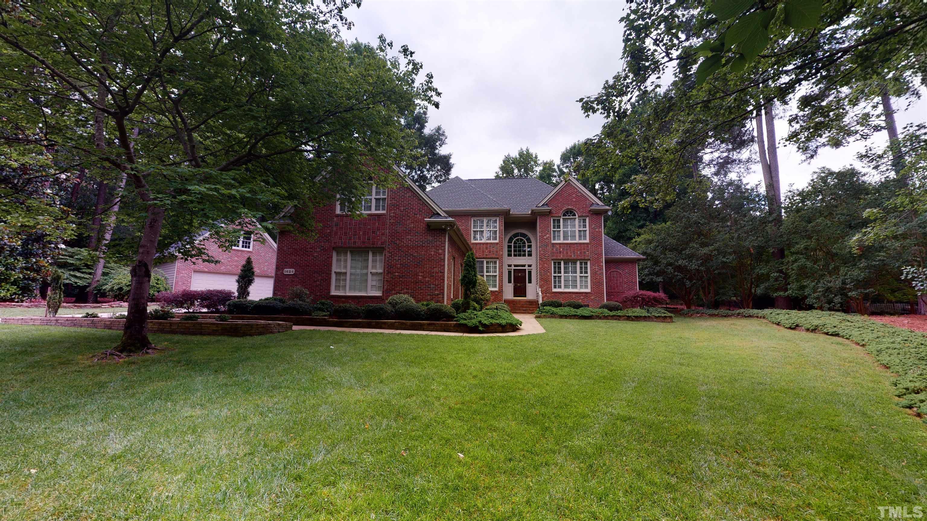 1624 Adams Mountain Road Raleigh, NC 27614 - Photo 79 of 100 a front view of a house with a garden