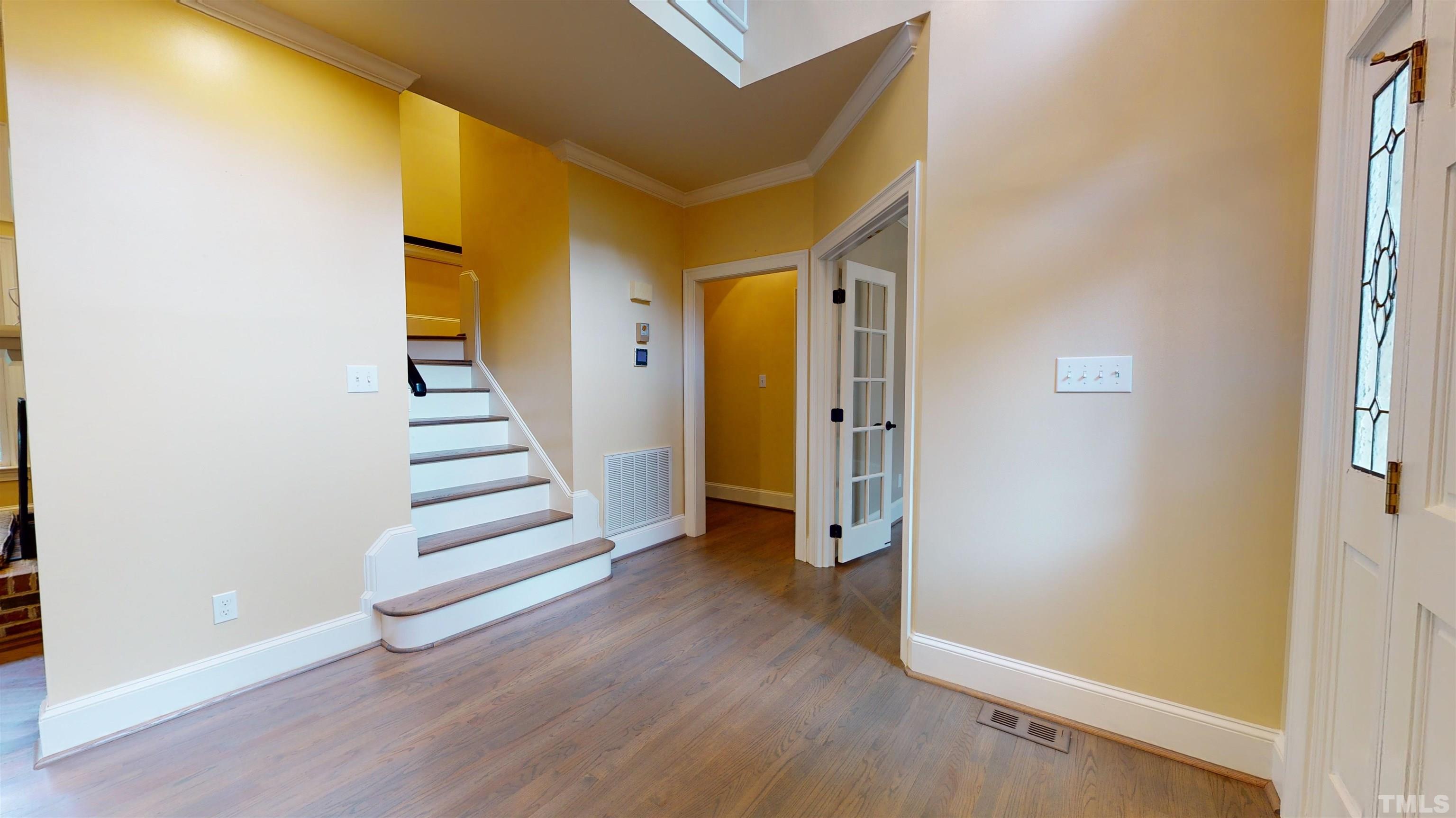 1624 Adams Mountain Road Raleigh, NC 27614 - Photo 8 of 100 a view of a hallway with wooden floor and entryway