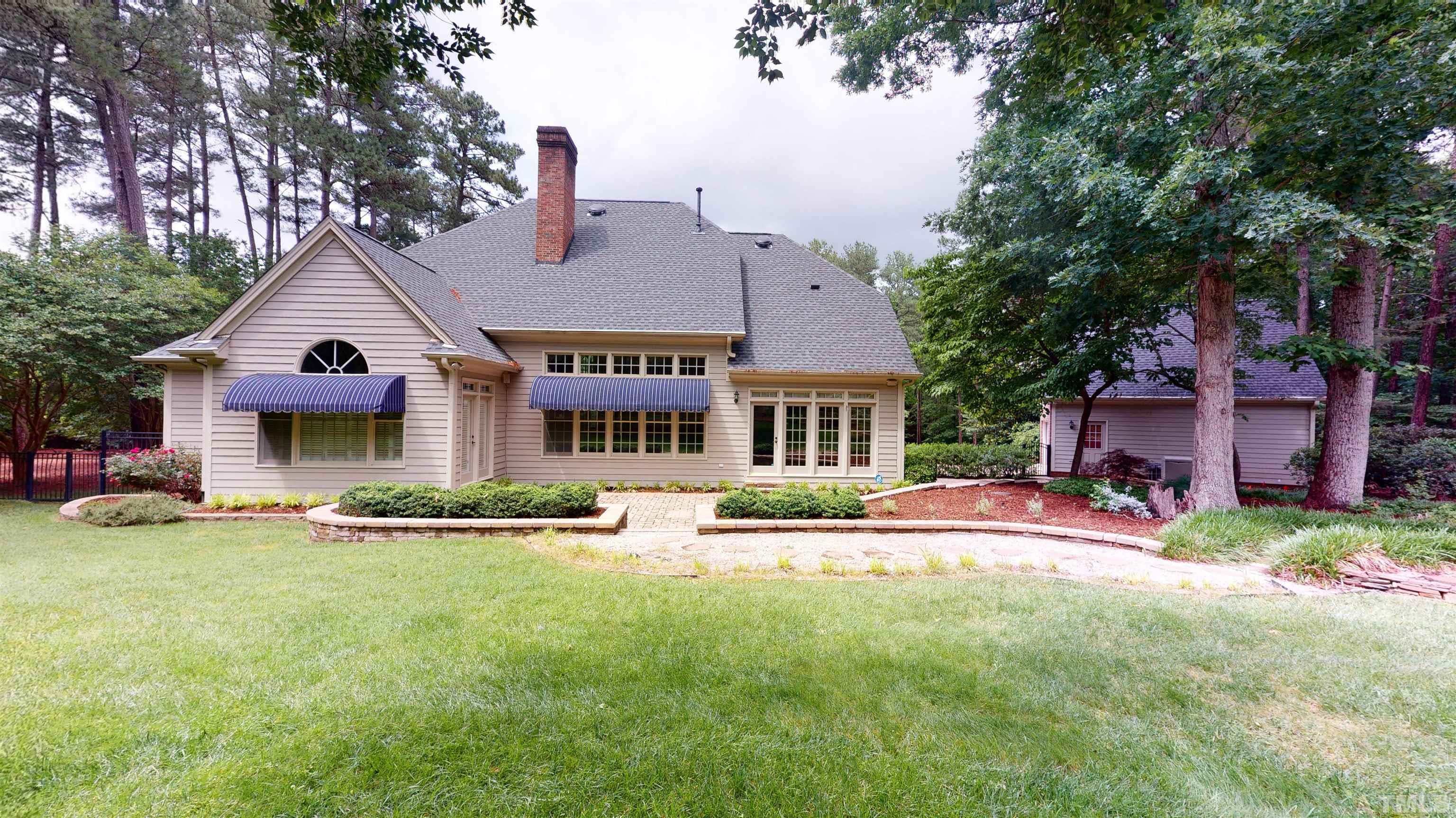 1624 Adams Mountain Road Raleigh, NC 27614 - Photo 95 of 100 a view of a house with a yard and sitting area