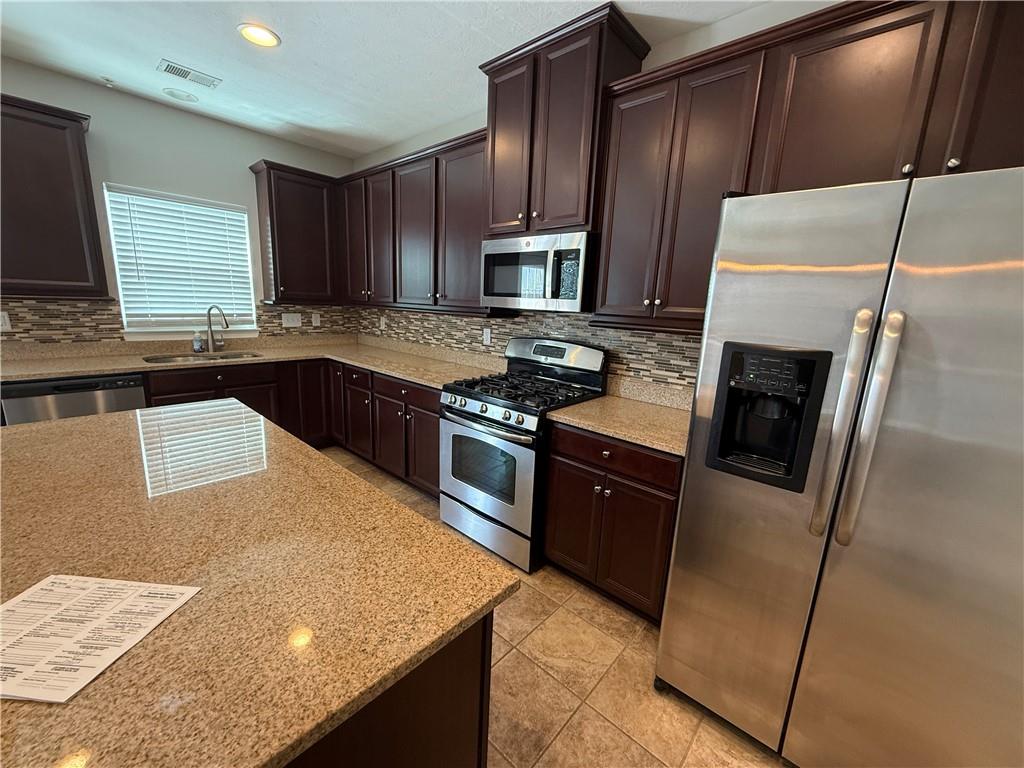 202 Pointe View Drive Mars, PA 16046 - Photo 2 of 10 a kitchen with stainless steel appliances granite countertop a sink stove and refrigerator