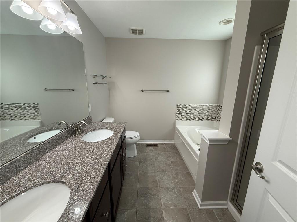 202 Pointe View Drive Mars, PA 16046 - Photo 4 of 10 a bathroom with a granite countertop sink a mirror and a bathtub
