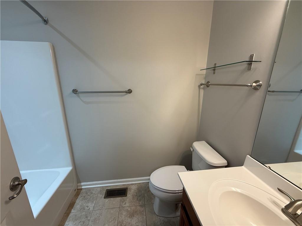 202 Pointe View Drive Mars, PA 16046 - Photo 10 of 10 a white toilet sitting next to a bath tub