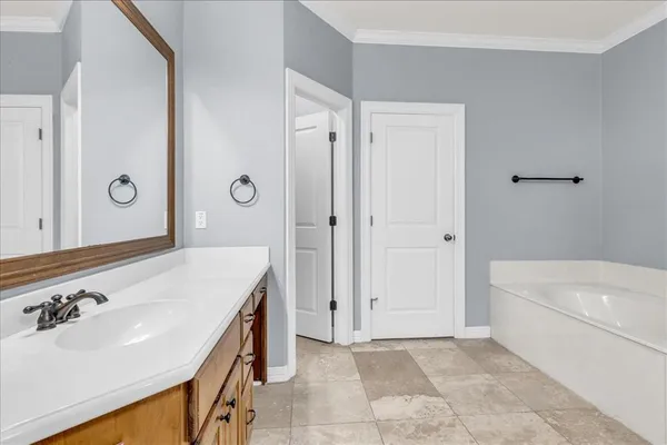 a bathroom with a sink and a bathtub