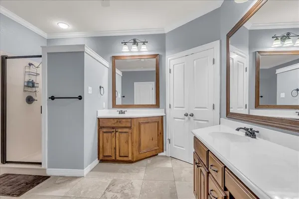 a spacious bathroom with a double vanity sink mirror and
