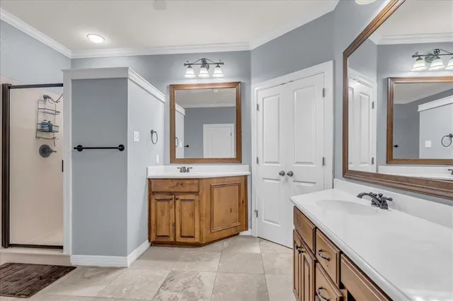 a spacious bathroom with a double vanity sink mirror and