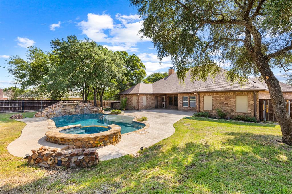 1865 Austin Hines Drive China Spring, TX 76633 - Photo 23 of 30 a swimming pool with outdoor seating and yard