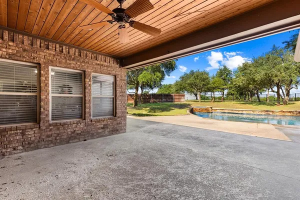a view of swimming pool with a yard