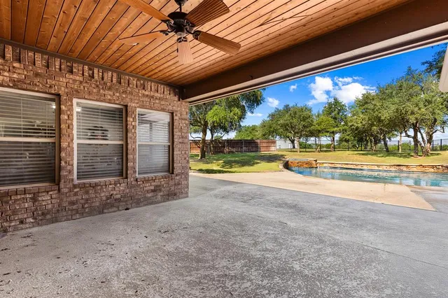 a view of swimming pool with a yard