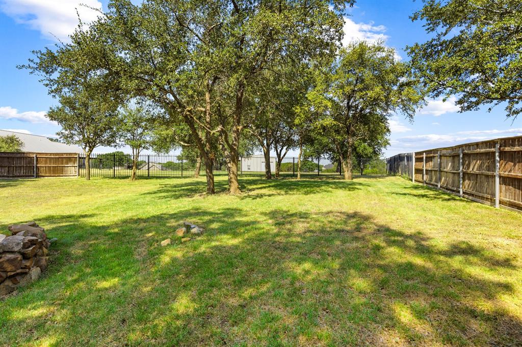 1865 Austin Hines Drive China Spring, TX 76633 - Photo 26 of 30 a swimming pool with outdoor seating and yard