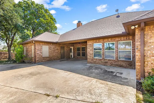 a view of a house with a backyard and a garage