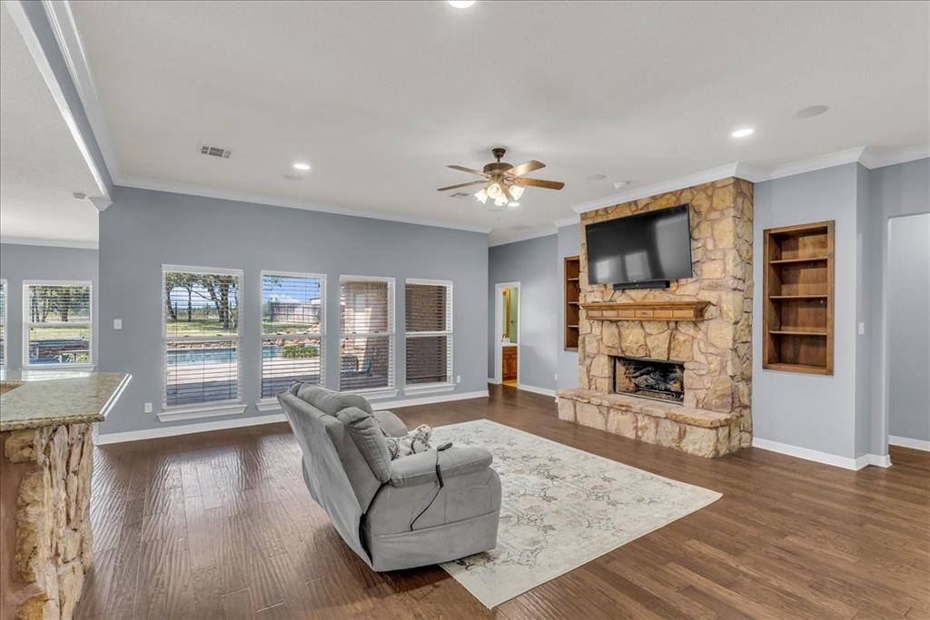 1865 Austin Hines Drive China Spring, TX 76633 - Photo 6 of 30 a living room with fireplace furniture and a flat screen tv