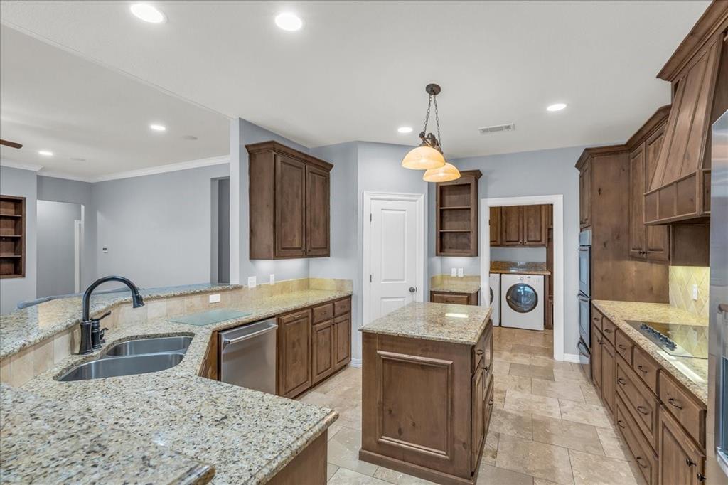 1865 Austin Hines Drive China Spring, TX 76633 - Photo 7 of 30 a kitchen with stainless steel appliances granite countertop a sink a stove and a wooden floors