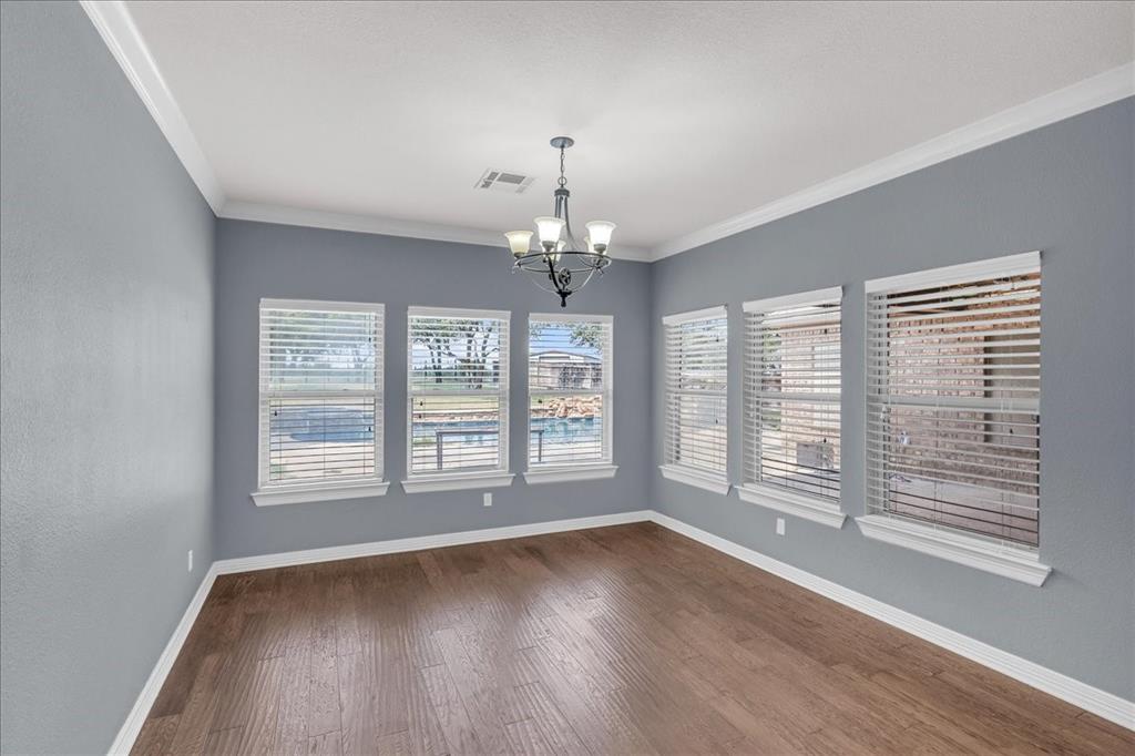 1865 Austin Hines Drive China Spring, TX 76633 - Photo 9 of 30 a view of an empty room with wooden floor and a window
