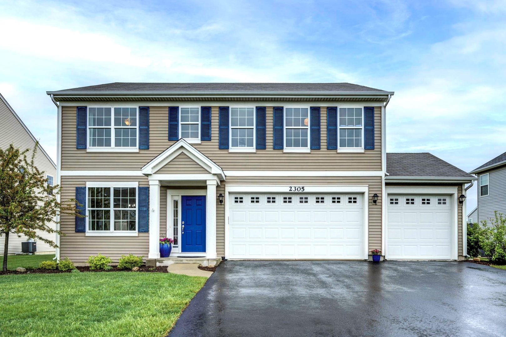 front view of a house with a yard