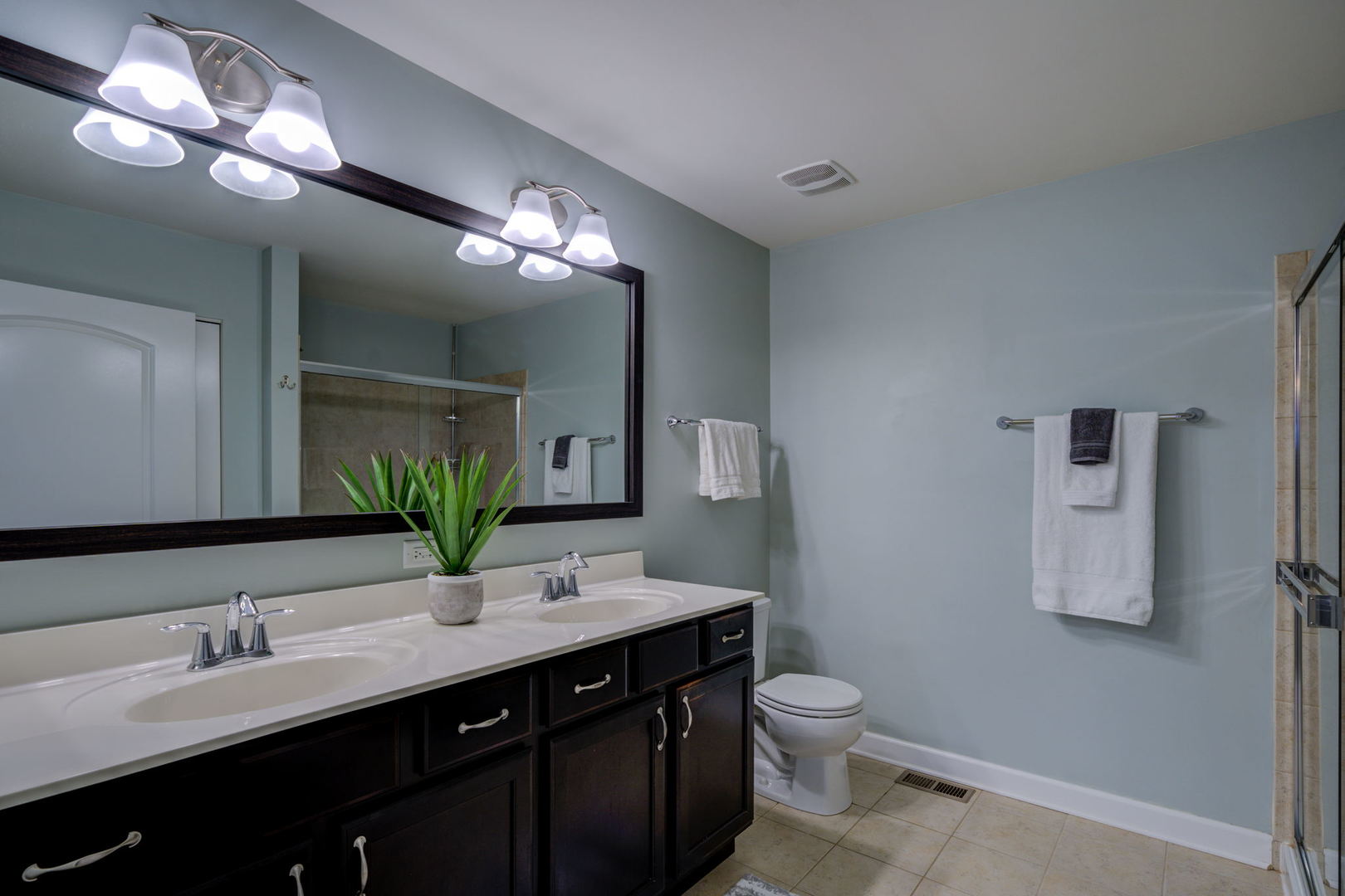 2305 Brookstone Drive Bolingbrook, IL 60490 - Photo 13 of 26 a bathroom with a double vanity sink mirror and toilet