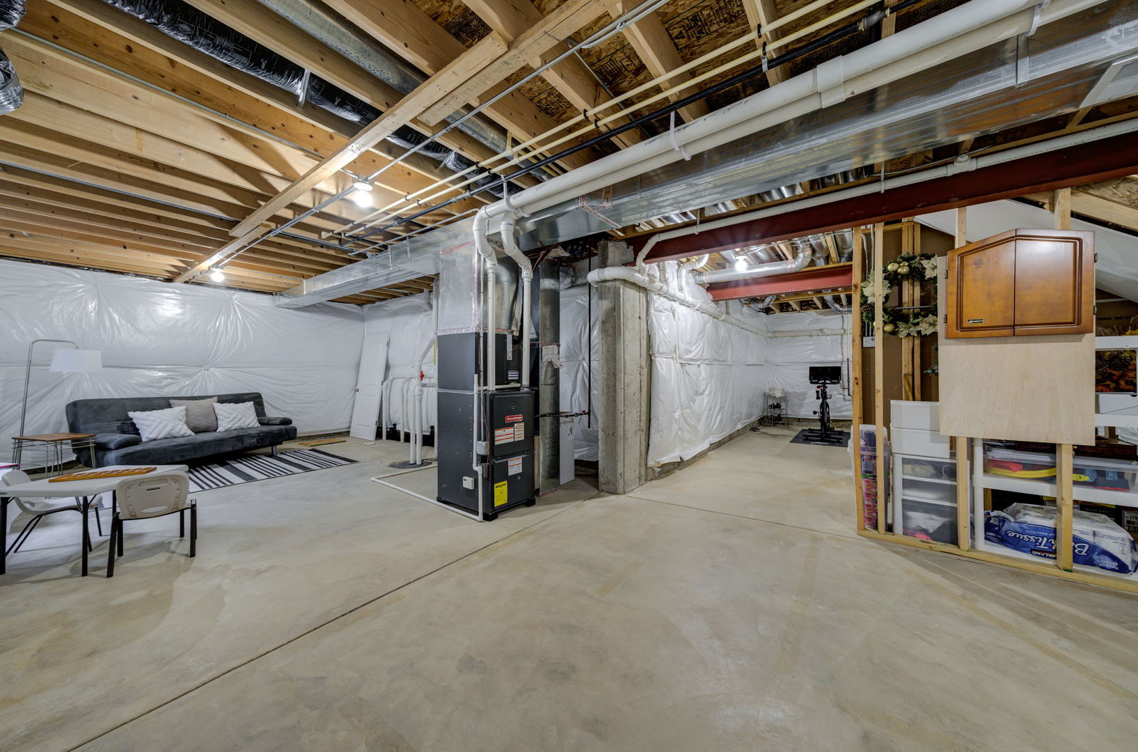 2305 Brookstone Drive Bolingbrook, IL 60490 - Photo 19 of 26 a view of empty room with wooden ceiling and furniture