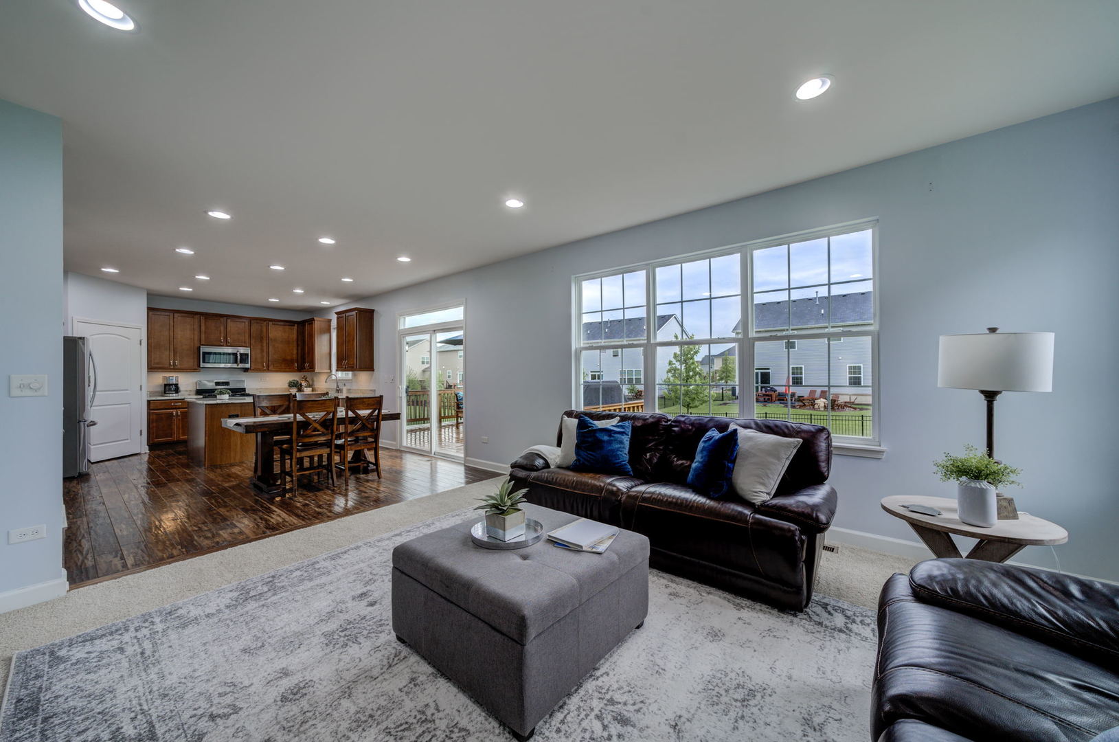 2305 Brookstone Drive Bolingbrook, IL 60490 - Photo 8 of 26 a living room with furniture kitchen view and a large window