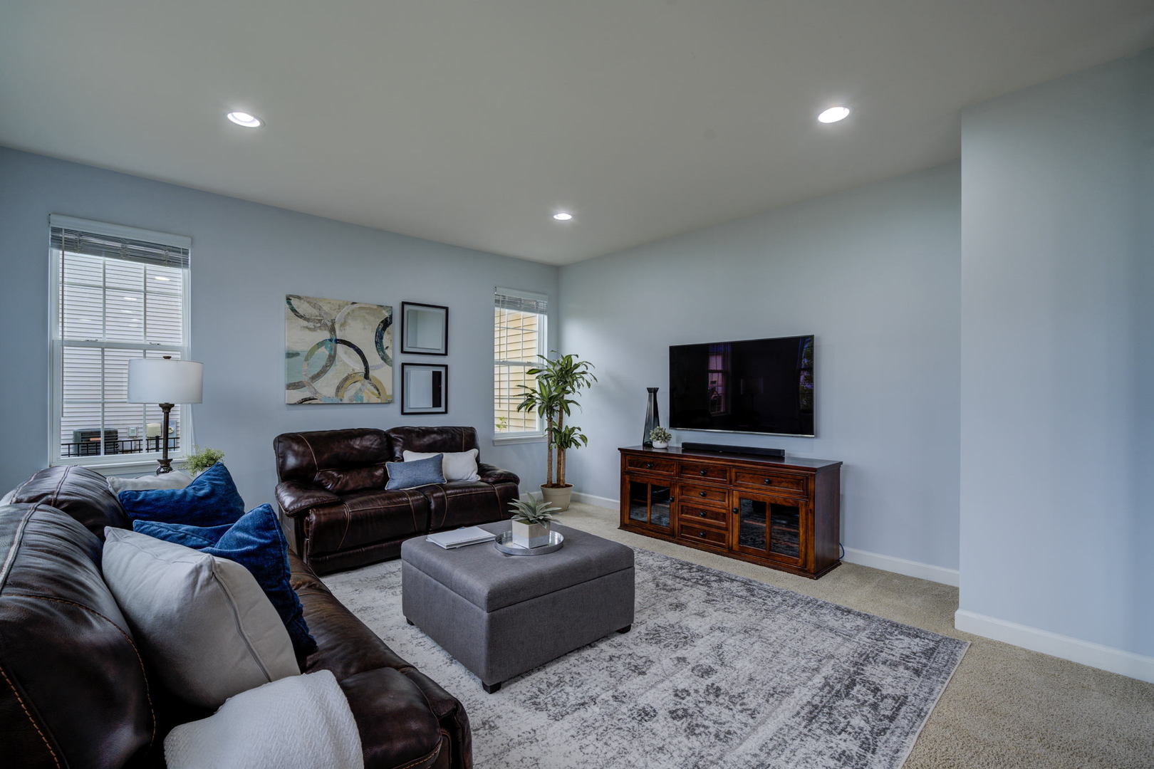 2305 Brookstone Drive Bolingbrook, IL 60490 - Photo 9 of 26 a living room with furniture and a flat screen tv