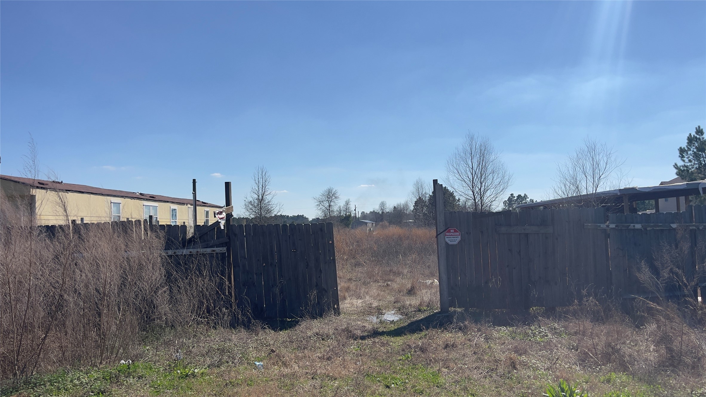905 County Road 5023 Cleveland, TX 77327 - Photo 2 of 6 a view of a backyard