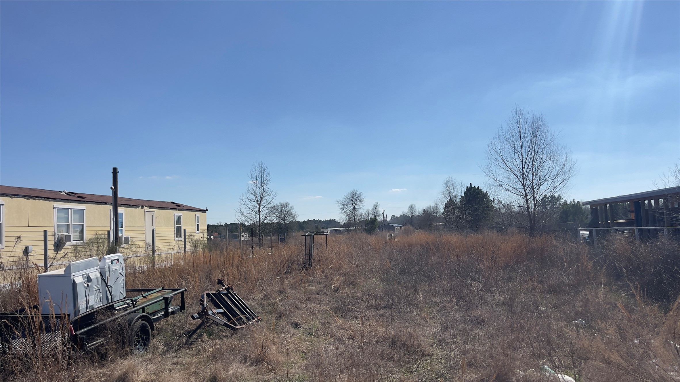 905 County Road 5023 Cleveland, TX 77327 - Photo 3 of 6 a view of a terrace with chairs