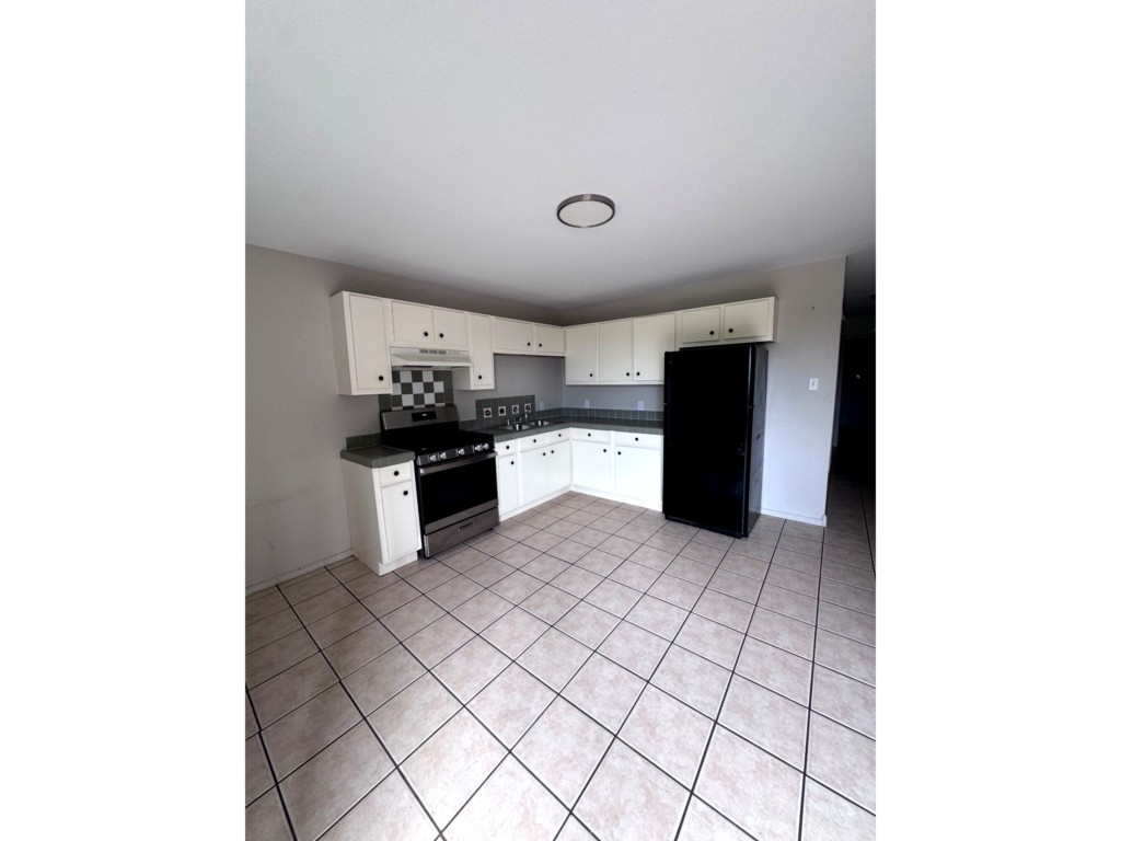 1504 Freeman Street Houston, TX 77009 - Photo 11 of 20 a kitchen with a sink and cabinets