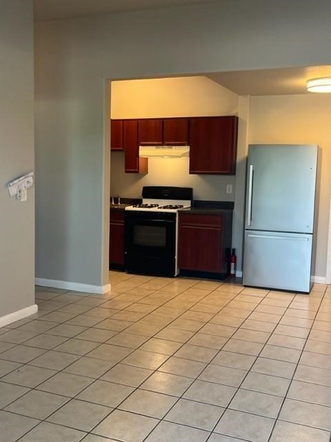 1504 Freeman Street Houston, TX 77009 - Photo 4 of 20 a kitchen with stainless steel appliances granite countertop a refrigerator and a stove