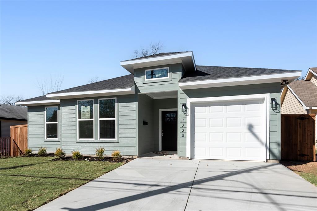 a front view of a house with garage