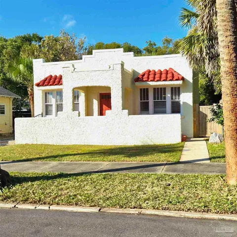 a view of swimming pool with an outdoor seating