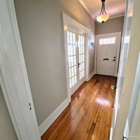 a view of entryway with wooden floor