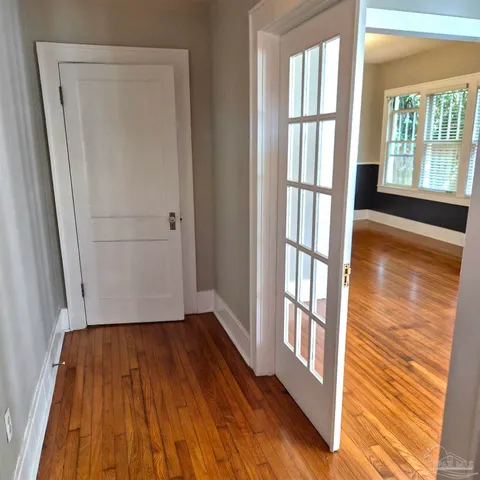 a view of front door with wooden floor