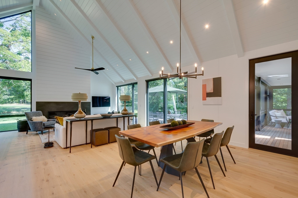 77 Weston Road Lincoln, MA 01773 - Photo 8 of 41 a view of a dining room with furniture and wooden floor