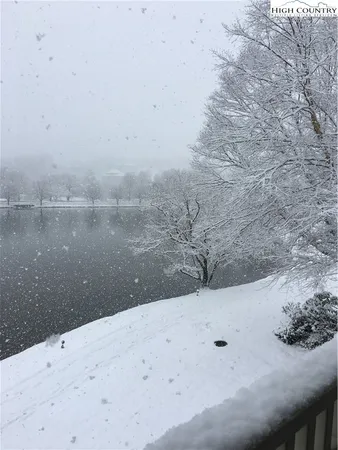a view of a lake with outside a house
