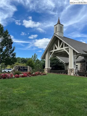 a view of a patio with table and chairs potted plants with sky view