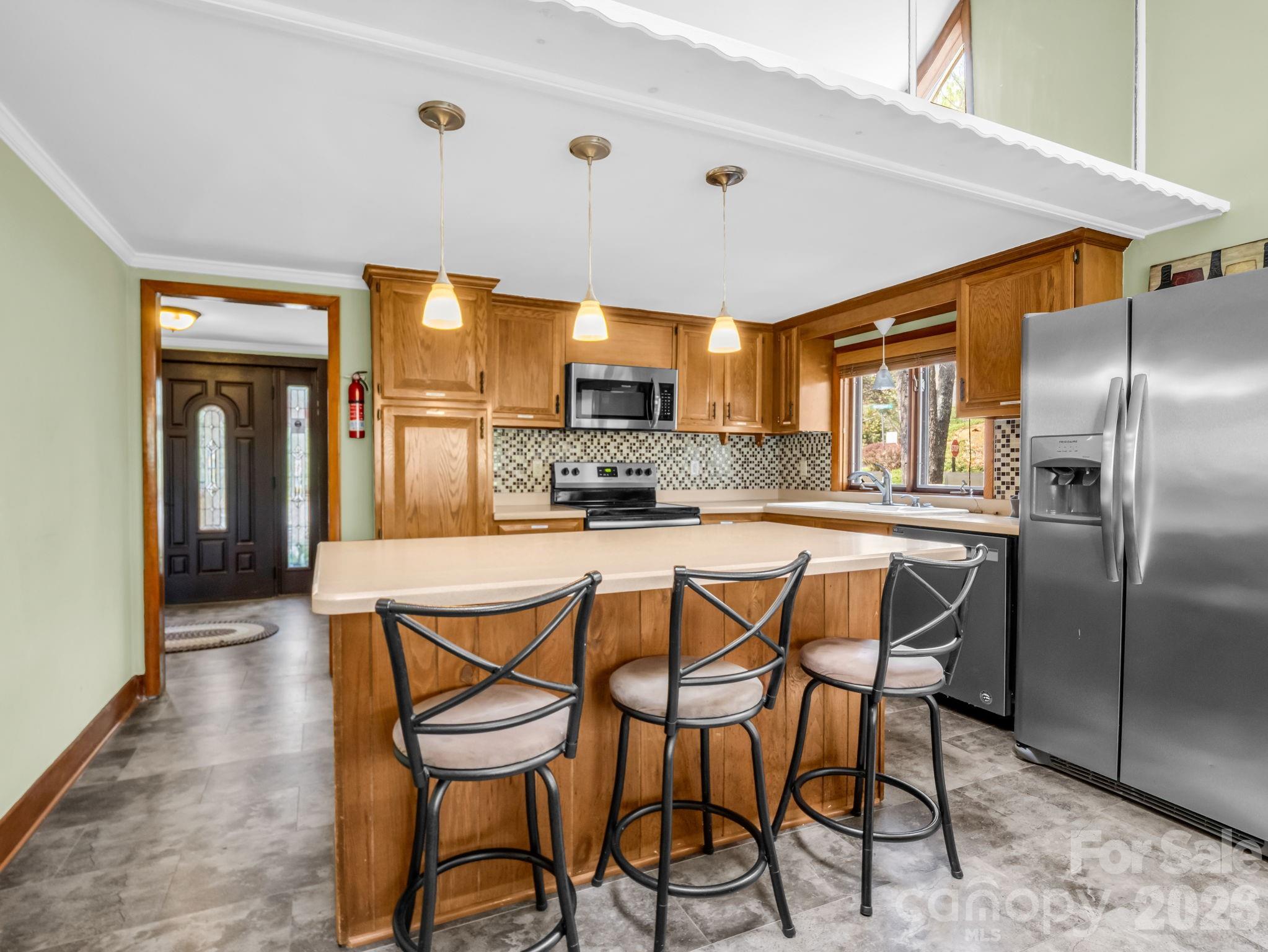 307 Watership Road Lake Lure, NC 28746 - Photo 12 of 48 a table and chairs in a kitchen
