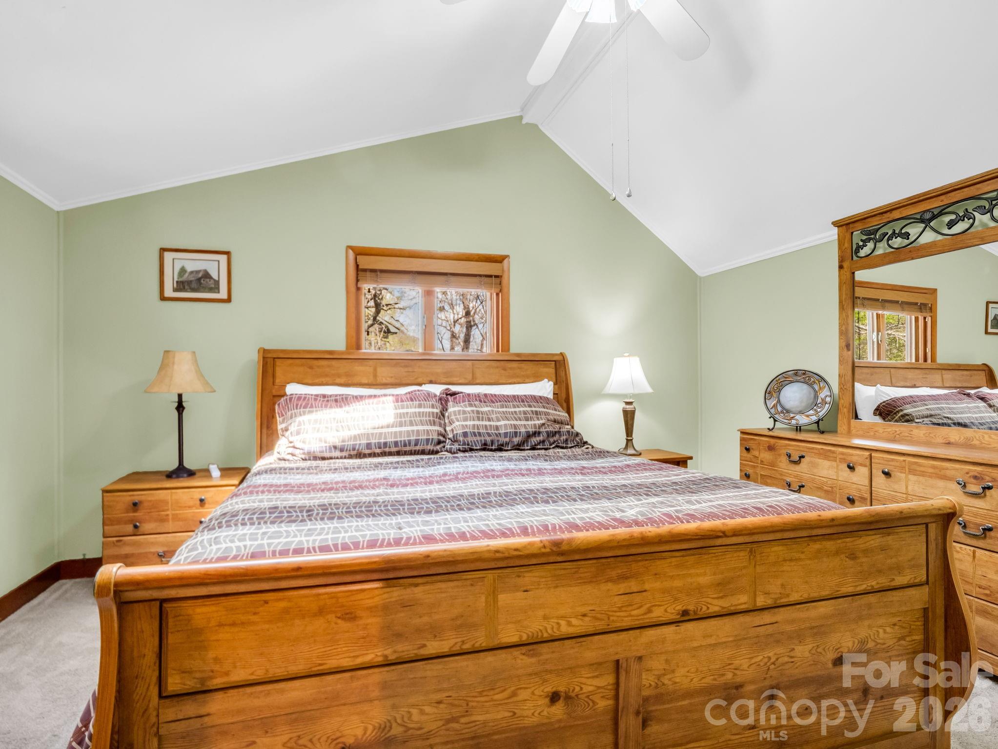 307 Watership Road Lake Lure, NC 28746 - Photo 18 of 48 a bedroom with a bed and wooden floor