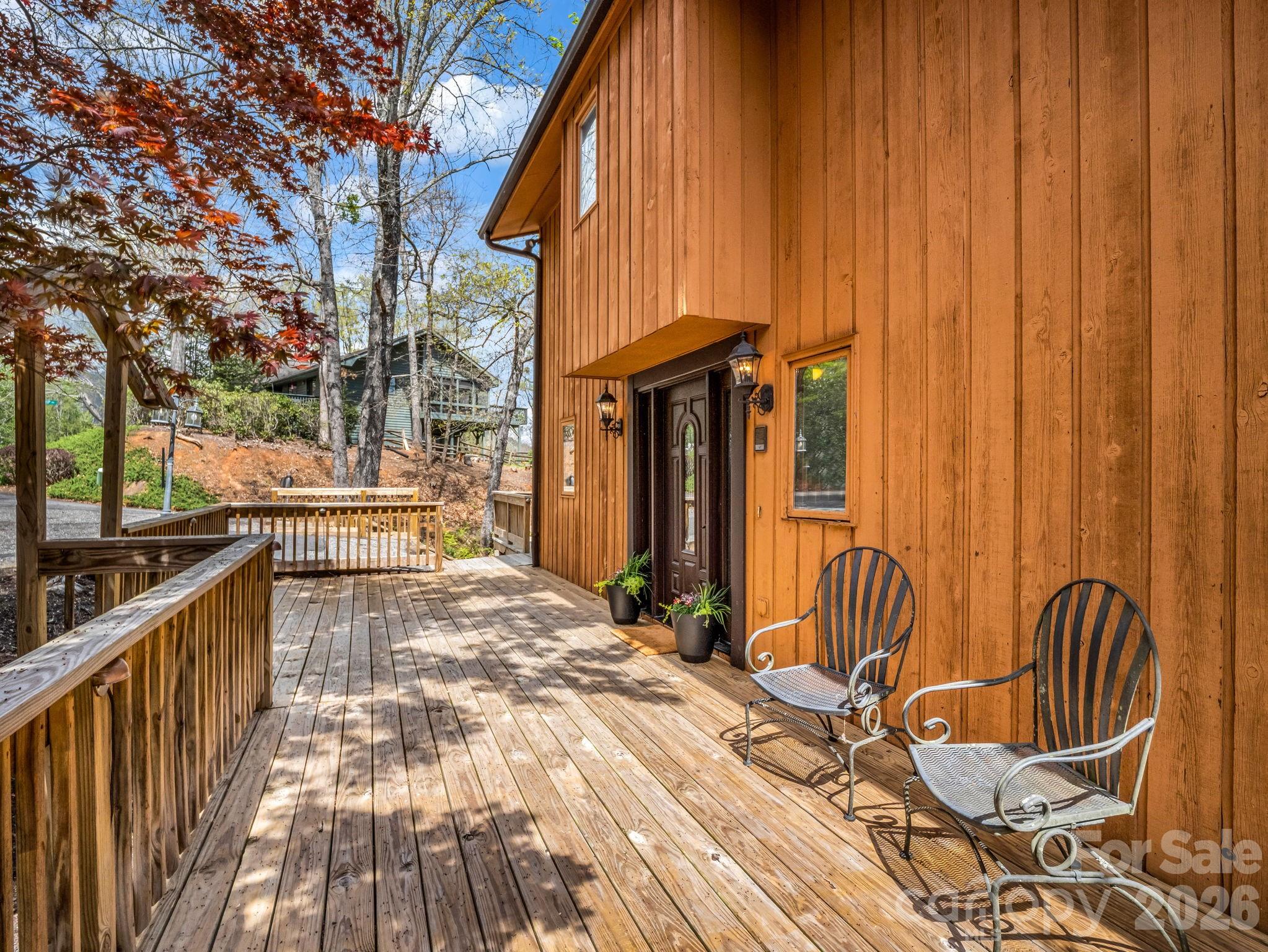 307 Watership Road Lake Lure, NC 28746 - Photo 2 of 48 a view of a chairs and table on the wooden floor