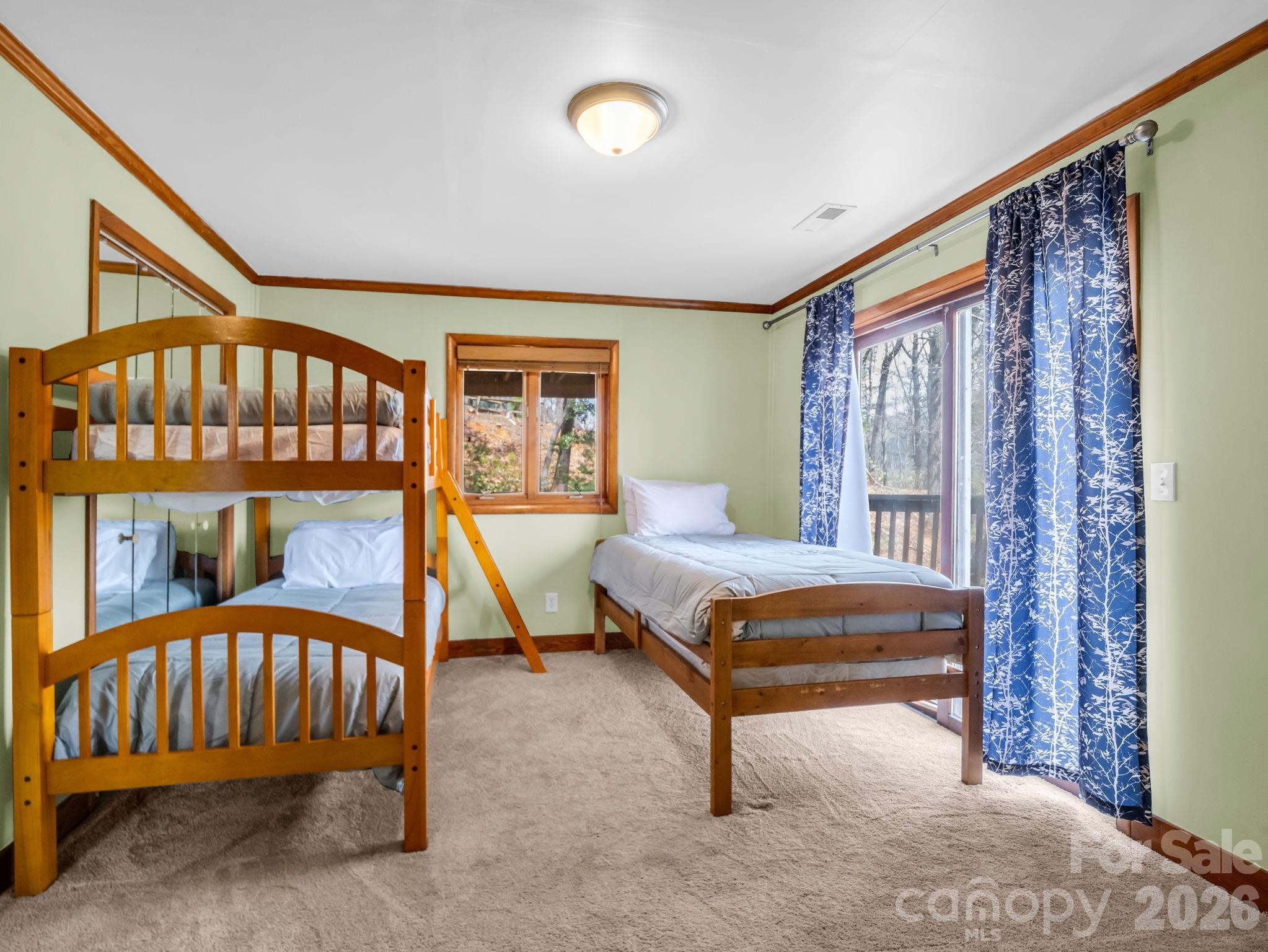 307 Watership Road Lake Lure, NC 28746 - Photo 24 of 48 a bedroom with a bed and a window