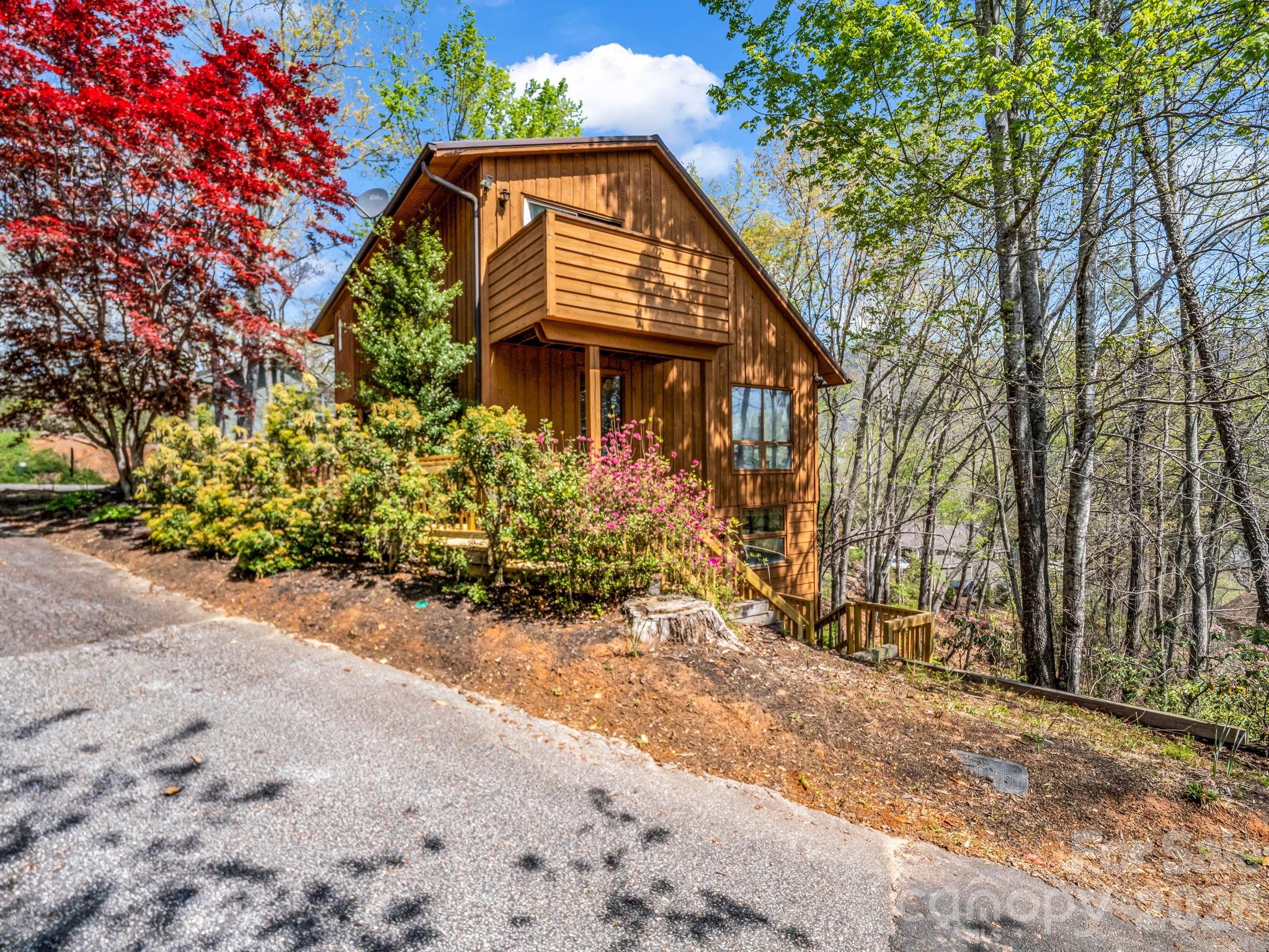 307 Watership Road Lake Lure, NC 28746 - Photo 35 of 48 a view of a house with a small yard