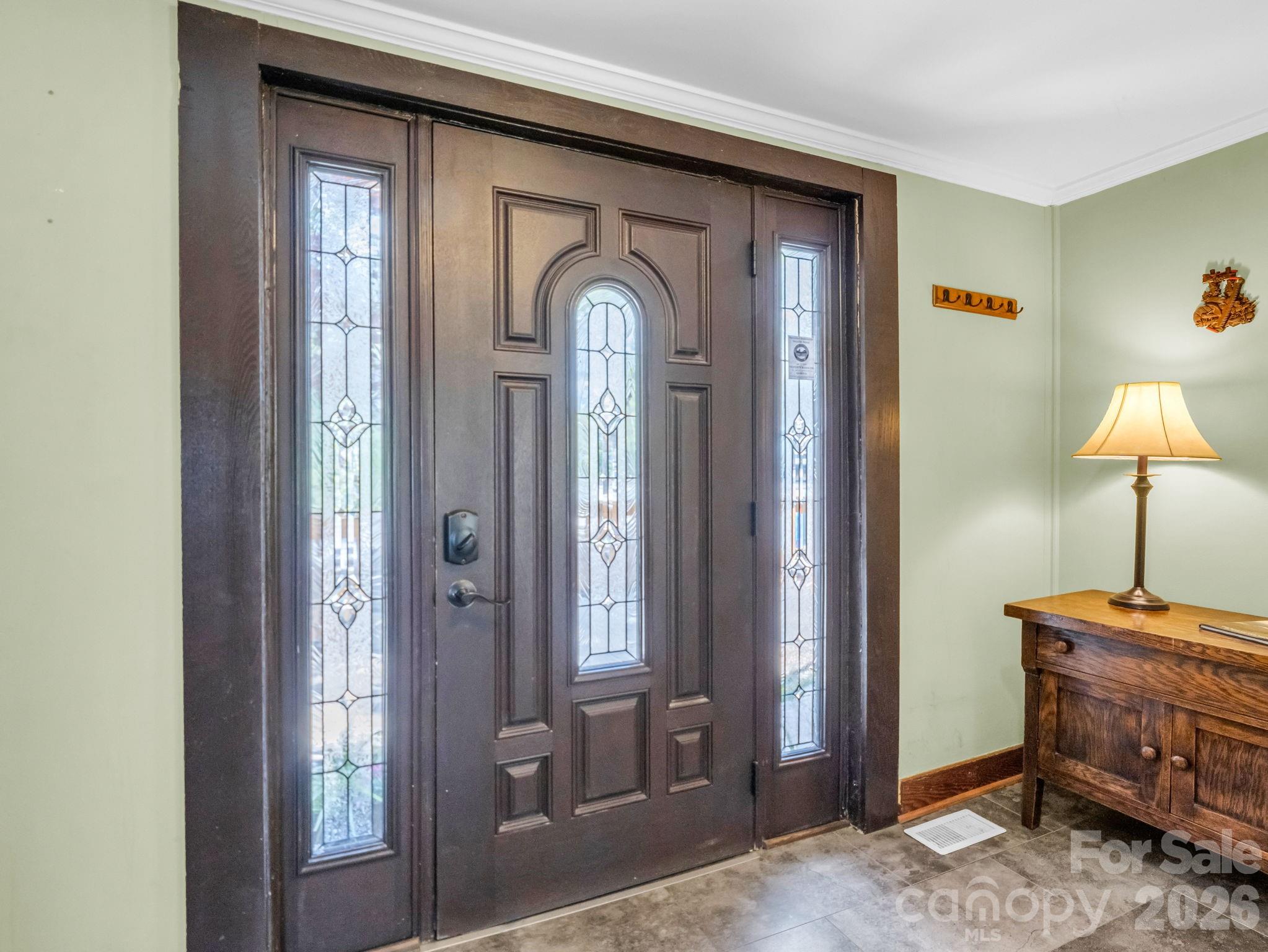307 Watership Road Lake Lure, NC 28746 - Photo 4 of 48 a room that has a dresser and a mirror in it