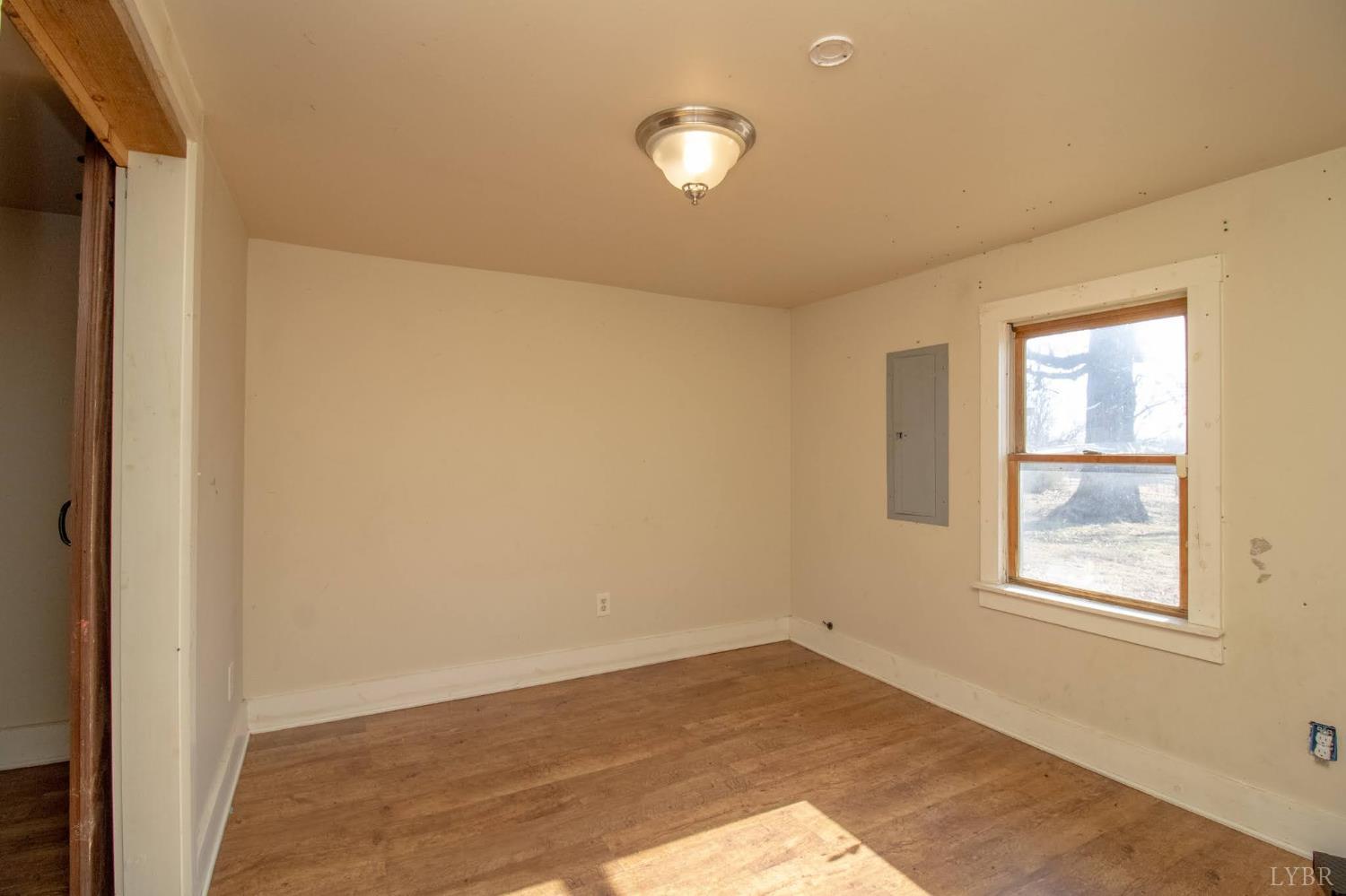 3039 T N Snow Road Nathalie, VA 24577 - Photo 16 of 50 a view of empty room with wooden floor and fan