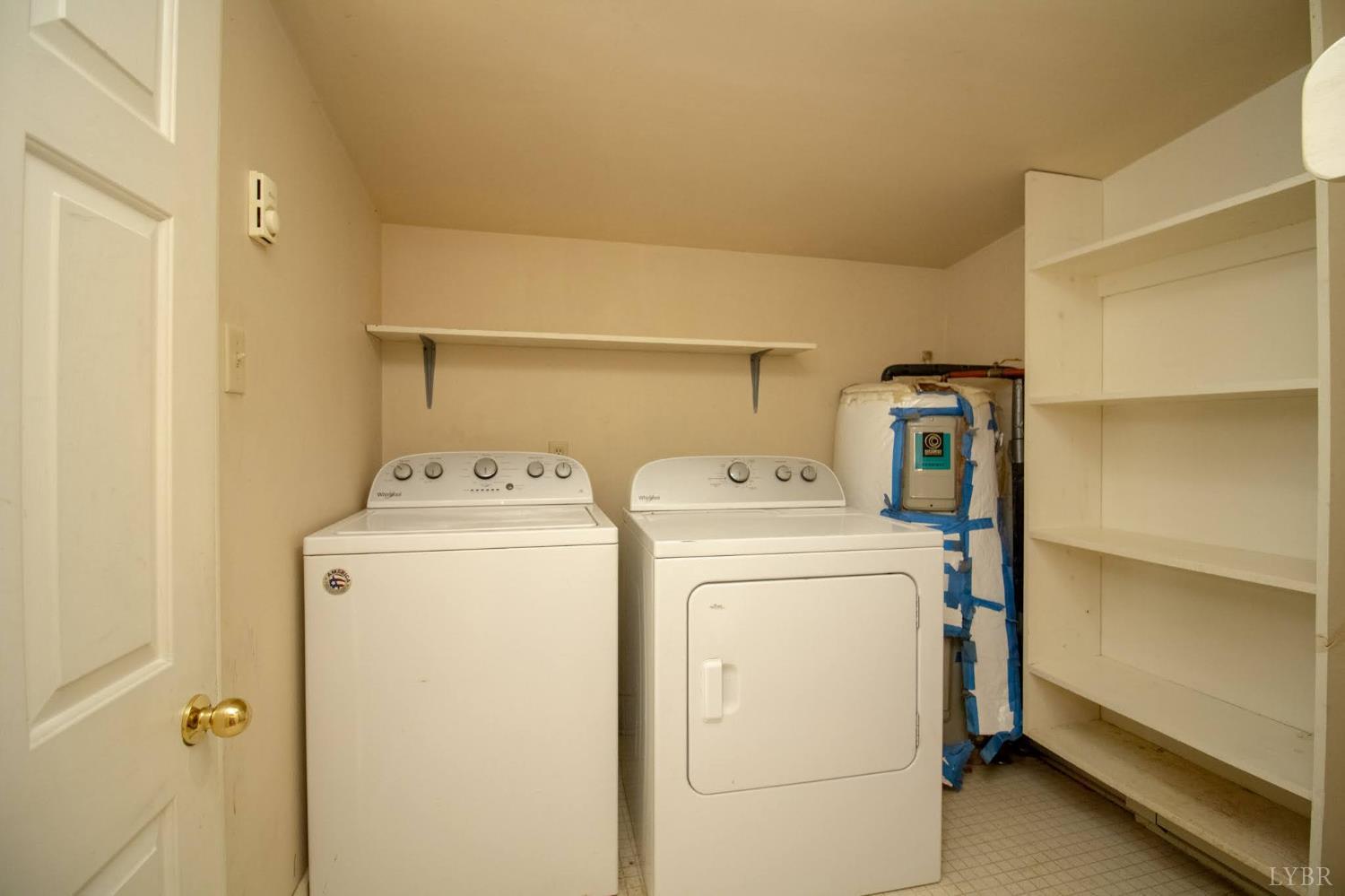 3039 T N Snow Road Nathalie, VA 24577 - Photo 19 of 50 a utility room with dryer and washer