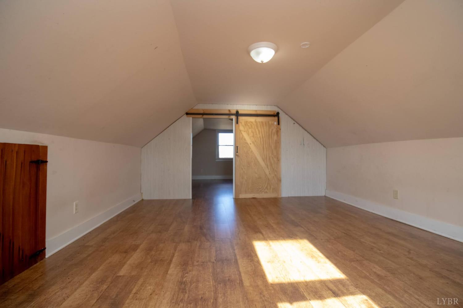3039 T N Snow Road Nathalie, VA 24577 - Photo 21 of 50 a view of empty room with wooden floor and fan