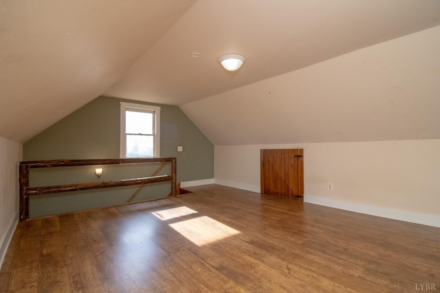3039 T N Snow Road Nathalie, VA 24577 - Photo 23 of 50 a view of an empty room with wooden floor and a window
