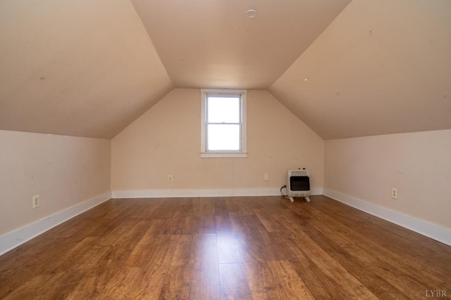 3039 T N Snow Road Nathalie, VA 24577 - Photo 24 of 50 an empty room with wooden floor and a window