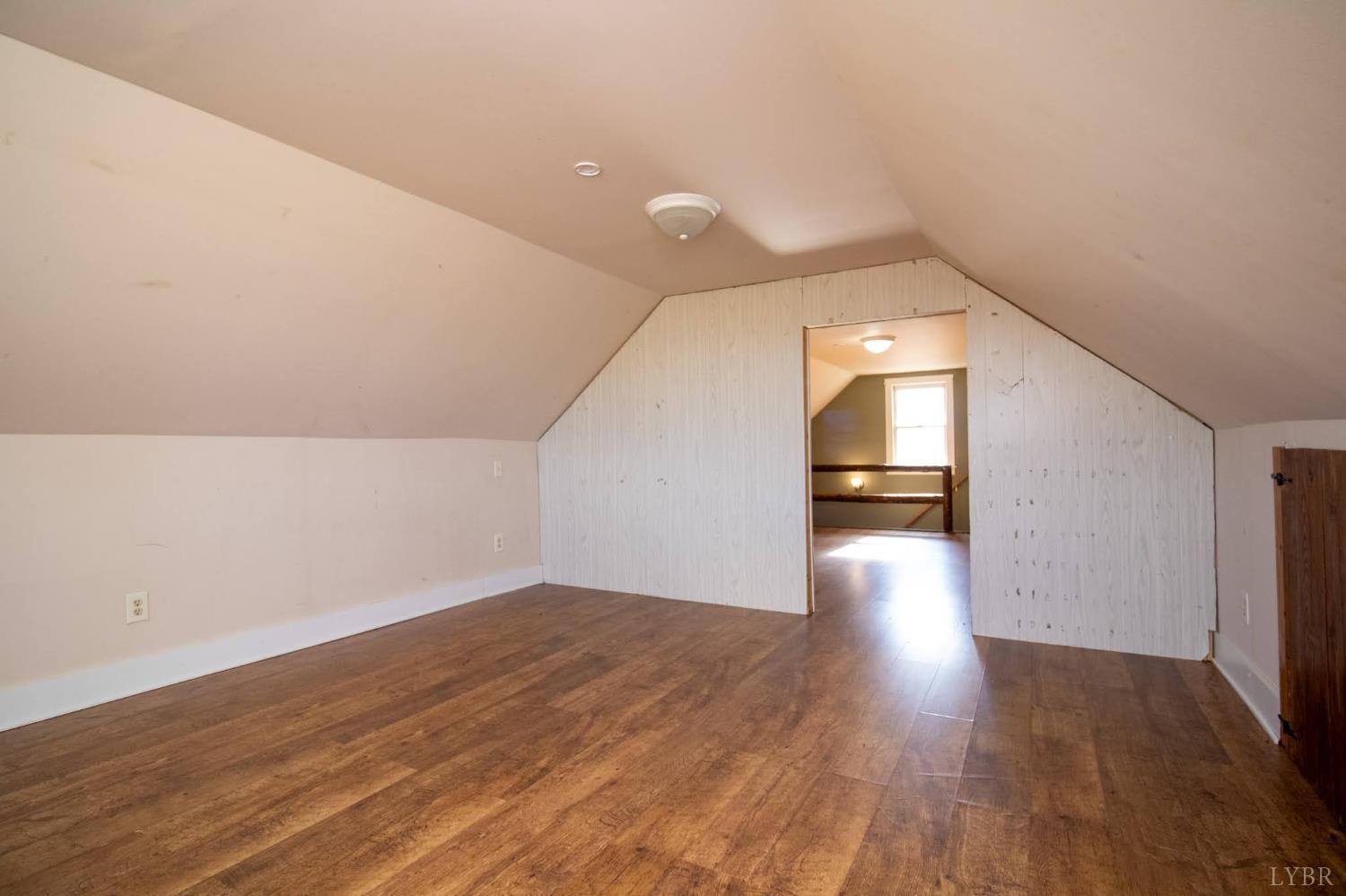3039 T N Snow Road Nathalie, VA 24577 - Photo 25 of 50 a view of a hallway with wooden floor